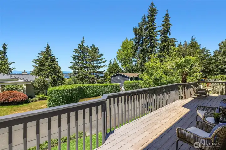 Striking views of Lake Washington and Olympic mountains take center stage in this centrally located Houghton home. The the sundrenched deck wraps around two sides of the house