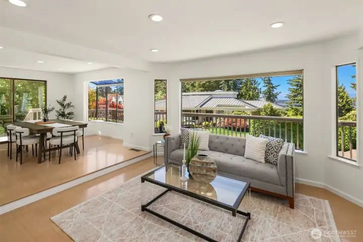 The heart of the home is a light-filled gathering space where oversized windows frame Lake Washington beyond and subtle architectural transitions define each room without sacrificing openness