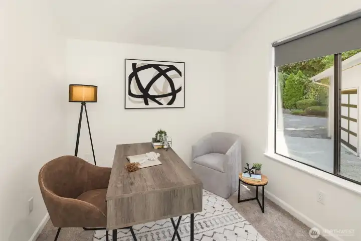 One of two bedrooms on the main floor, currently staged as an office.