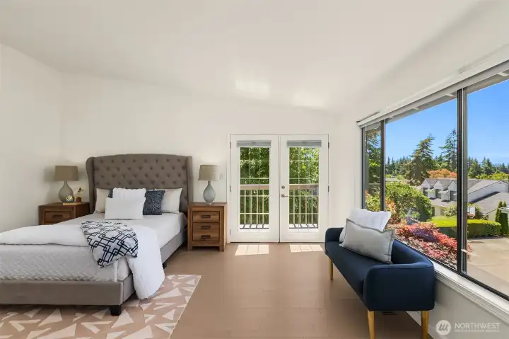 The huge picture window optimizes the view and French doors take you to your private deck in the primary suite