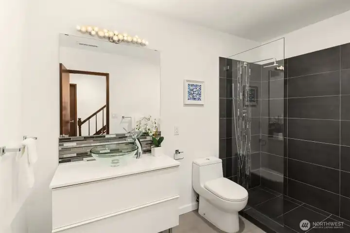 Fully updated three quarter bath on the lower level with large walk-in shower.