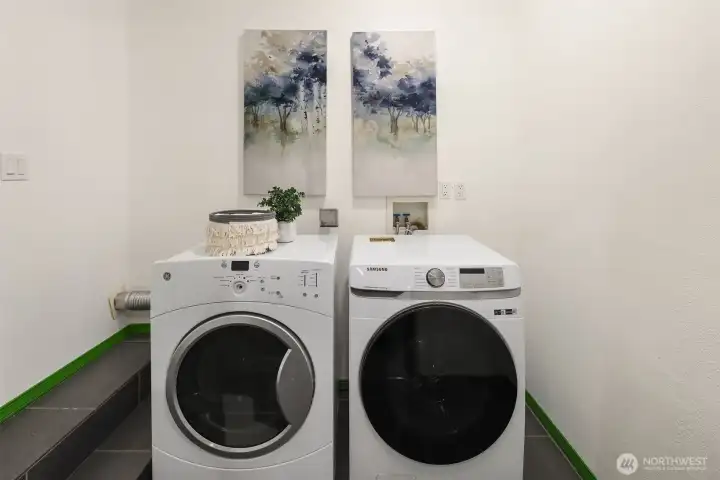 The laundry room is located through the garage - so can be easily shared with the lower level unit if that's set up as an income producing home.