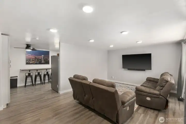 Entry room with lots of light and laminate flooring.
