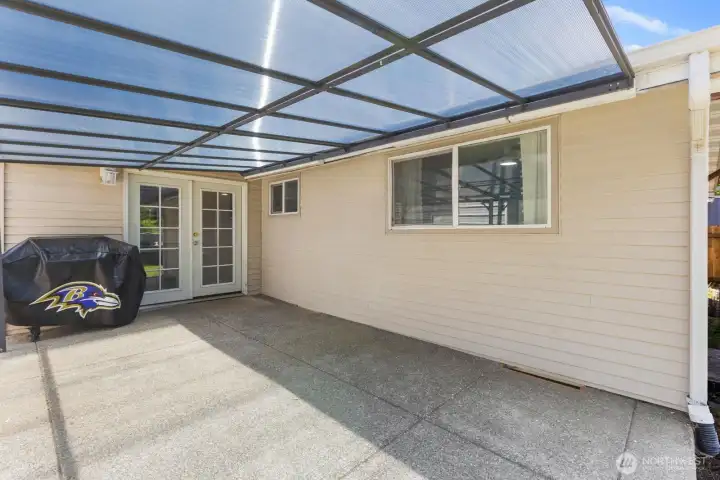 Directly off the kitchen is this covered patio which can be enjoyed all year long.