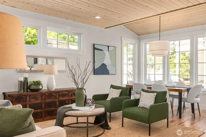The living room flows into a dining room space that accommodates 6 to 8 for dinner comfortably. The living room flows into a dining room space that accommodates 6 to 8 for dinner comfortably.