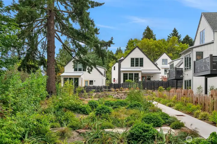 The lush gardens create a rich 'urban oasis' on the site, which is just minutes away from NE Seattle amenities. The lush gardens create a rich 'urban oasis' on the site, which is just minutes away from NE Seattle amenities.