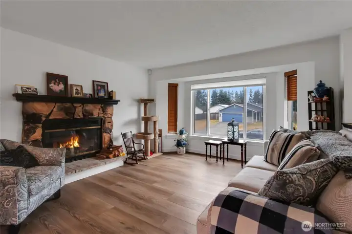 Living room with wood burning fireplace. Living room with wood burning fireplace.