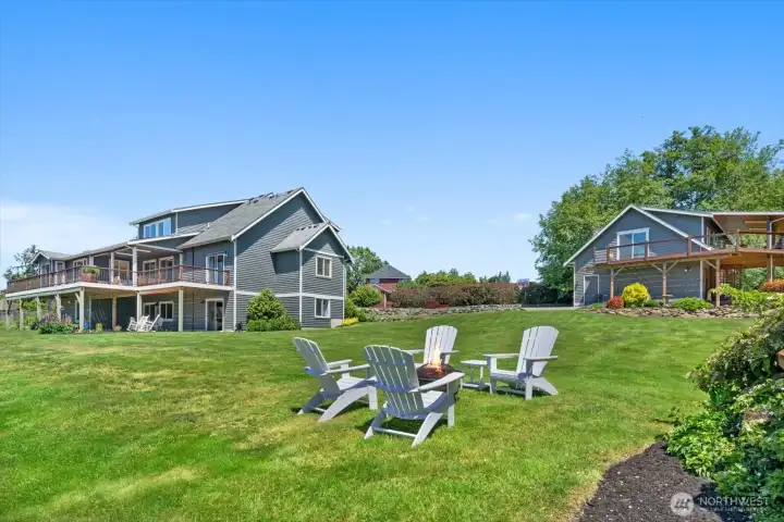 Backyard featuring open pastures, mountain views, and mature landscaping. Backyard featuring open pastures, mountain views, and mature landscaping.