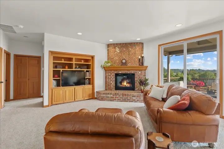 Main floor living room with ample natural lighting. Main floor living room with ample natural lighting.