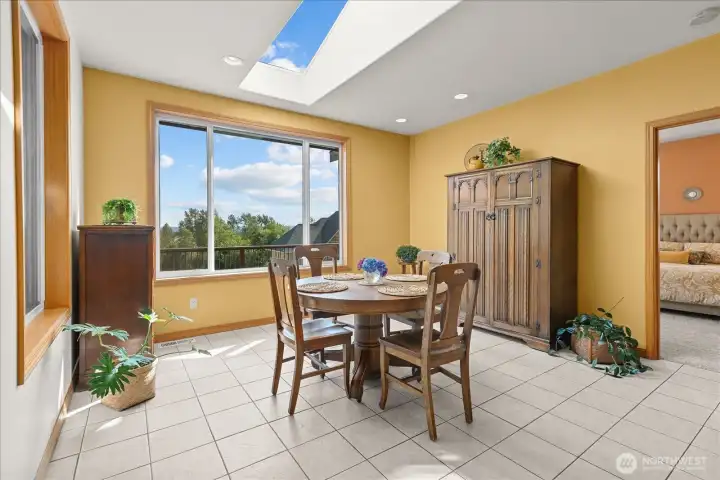 Breakfast nook with large window looking out to the backyard. Breakfast nook with large window looking out to the backyard.
