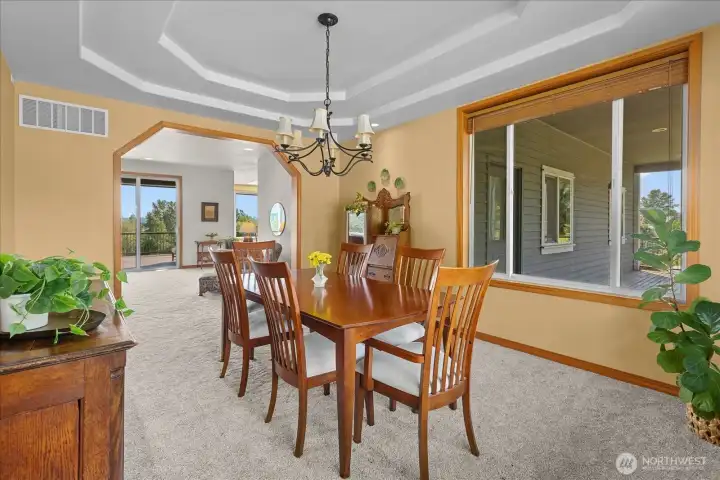 Formal dining room with living room access and breakfast nook in the back. Formal dining room with living room access and breakfast nook in the back.