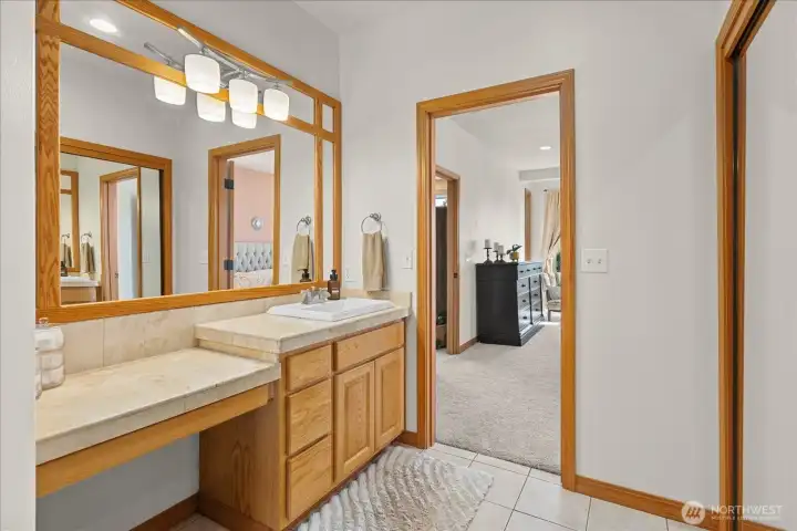 Primary suite bathroom with sink and vanity. Primary suite bathroom with sink and vanity.