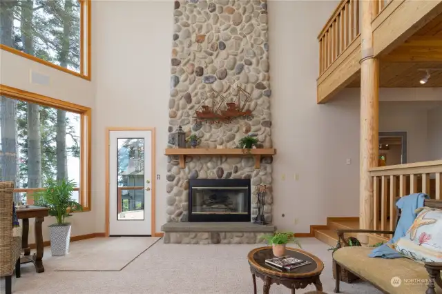 Beautiful built ins and detailing in this treasure of a home. Massive river rock fireplace is so handsome!
