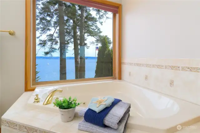 Corner jetted tub to soak in the views.