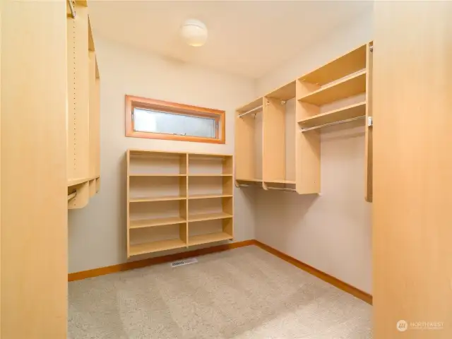 Huge walk in closet in the primary suite provides closet organizers.