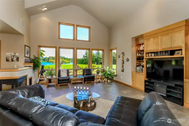 Great room with vaulted ceilings and tile floors