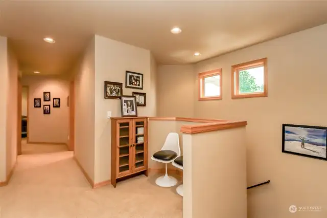 This home has a double staircase to access upstairs. This space was used for a computer area.