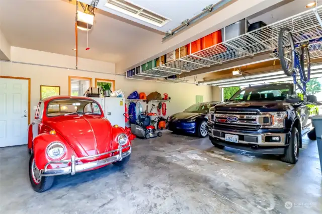 4 parking spaces with  2 garage doors,  Car for sale, 63 VW.