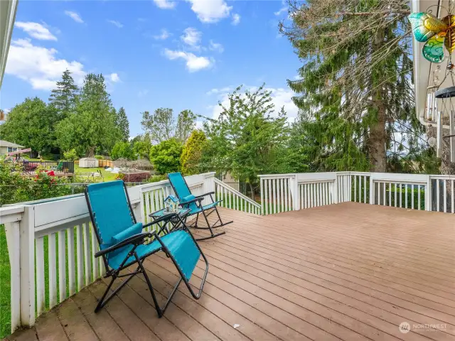 Spacious deck for outdoor entertaining. It overlooks the fenced back yard.