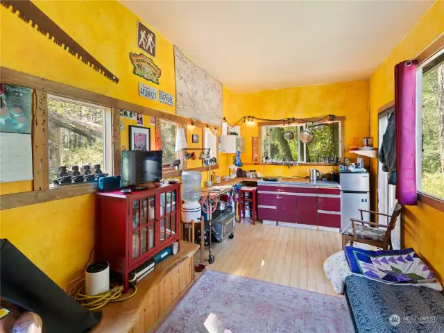 Galley-type area at the end of the room.