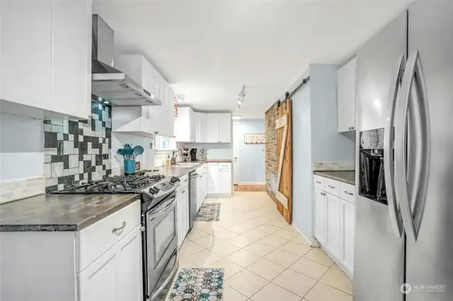 Expansive kitchen with stainless appliances