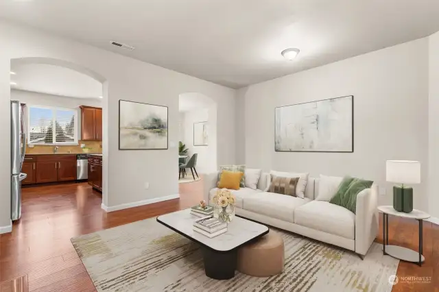 Living area leads into kitchen and dining room.