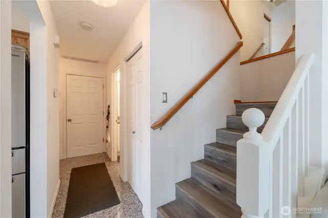 Stairs leading to the upper level, providing easy access to the home's private spaces