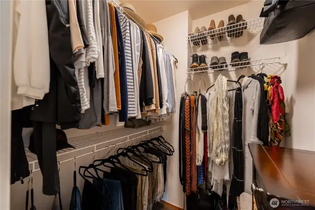 Spacious walk-in closet with ample storage and organizational options, providing a well-designed space for all your wardrobe needs