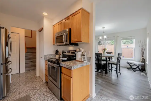 Spacious and open-concept kitchen and dining area, featuring a seamless flow for easy entertaining and daily living