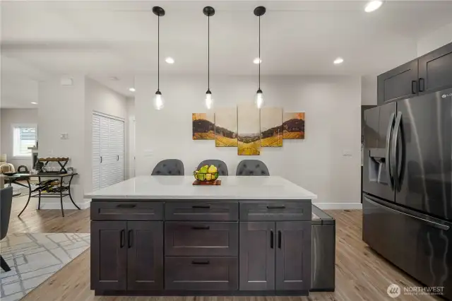 Breakfast bar with cabinetry below.