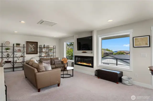 Upstairs family room with views of Puget Sound and Olympics.  Deck and the wet bar make will make this your favorite space.