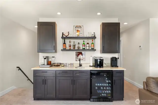 Wet bar with wine fridge and sink.  No need to travel downstairs for your drinks.