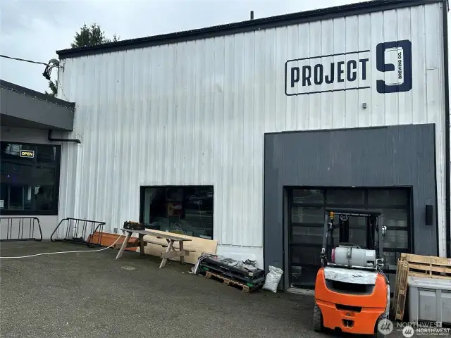 Dangerously close, Project 9 is a true neighbor, three doors away across the alley. New fun brew pub with sunny patio, food trucks, and a great vib