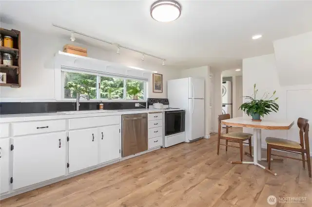 Entry way into kitchen with eating space