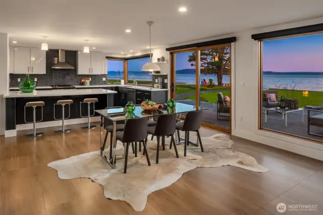Easy entertaining space with dining next to kitchen all while soaking in the views of the Sound.