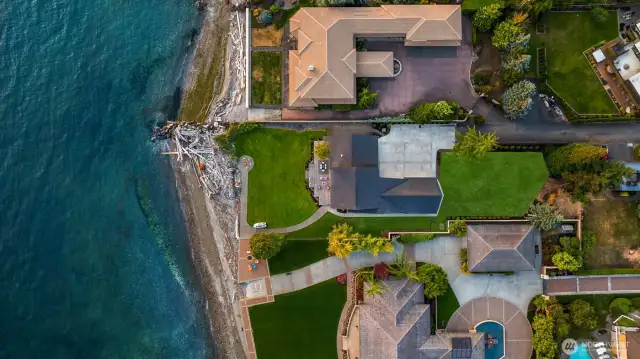 Aerial of property clearly denoting .65 acre which is rare waterfront flat lot.