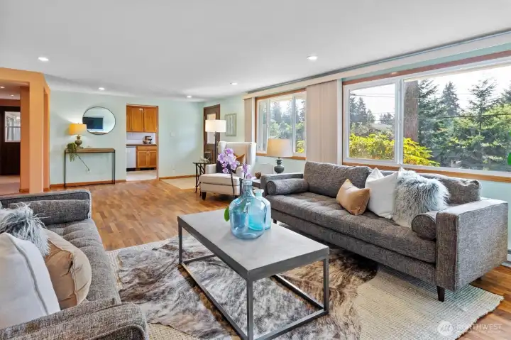 The living room is just amazing, mid-century modern proportions, recessed ceiling lights, big west-facing windows . . .