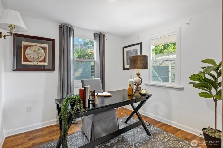 . . . the 3rd bedroom with corner windows is staged as an office.