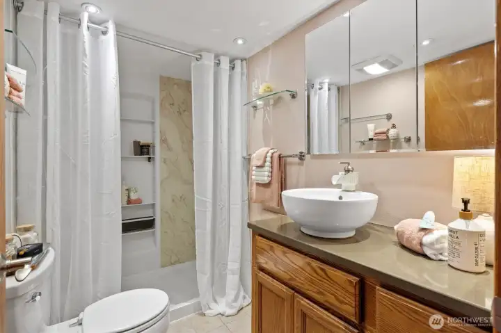 This 3/4 bath has secret storage underneath the towel rack!