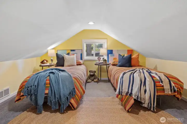 This upstairs bonus room is low-ceilinged, but can also be used for storage . . .
