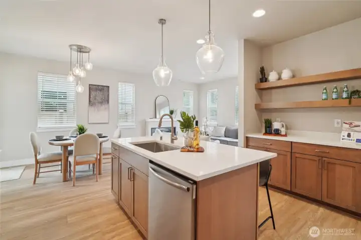 Photos of the staged model home with the same floorplan and similar finishes.