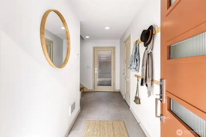 Spacious foyer includes a large entry closet, access to garage, separate access to the yard.