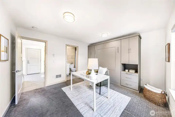 ground floor guest suite with en suite bathroom. Murphy bed and built in desk provides maximum flexibility