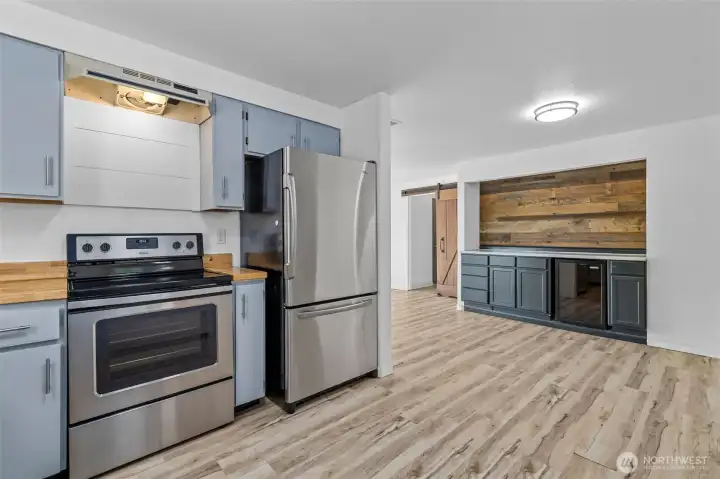 Extra storage and wine fridge conveniently off the kitchen. You can set up an epic coffee station here!