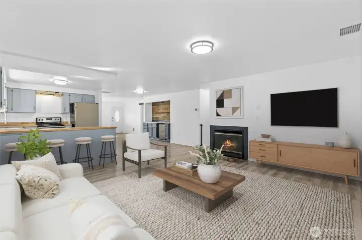 Gather around the cozy wood-burning fireplace. *Virtually Staged*