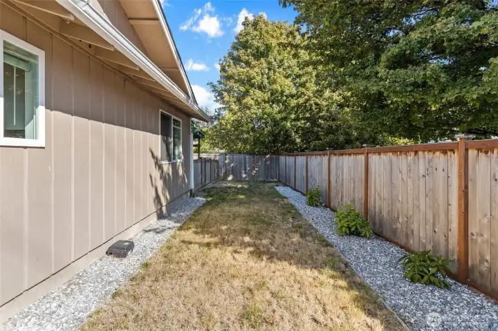 Grassy dog-run! Or use this space for a beautiful garden.