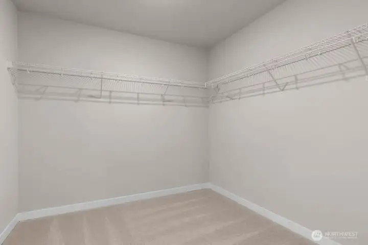 Huge primary closet. Colors and finishes may vary.