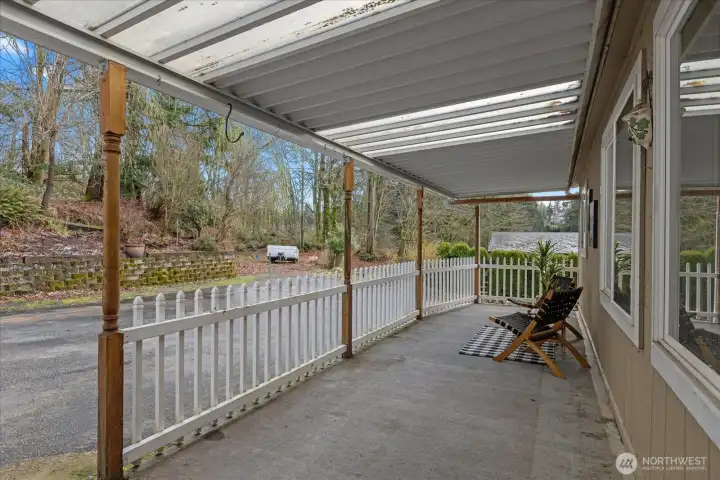 Enjoy your coffee on the front porch and watch for deer to come by from the treed lot behind you.