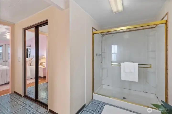 Large walk in closet in primary bathroom