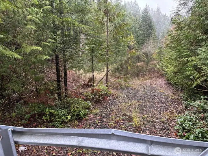 Level building site past gate.